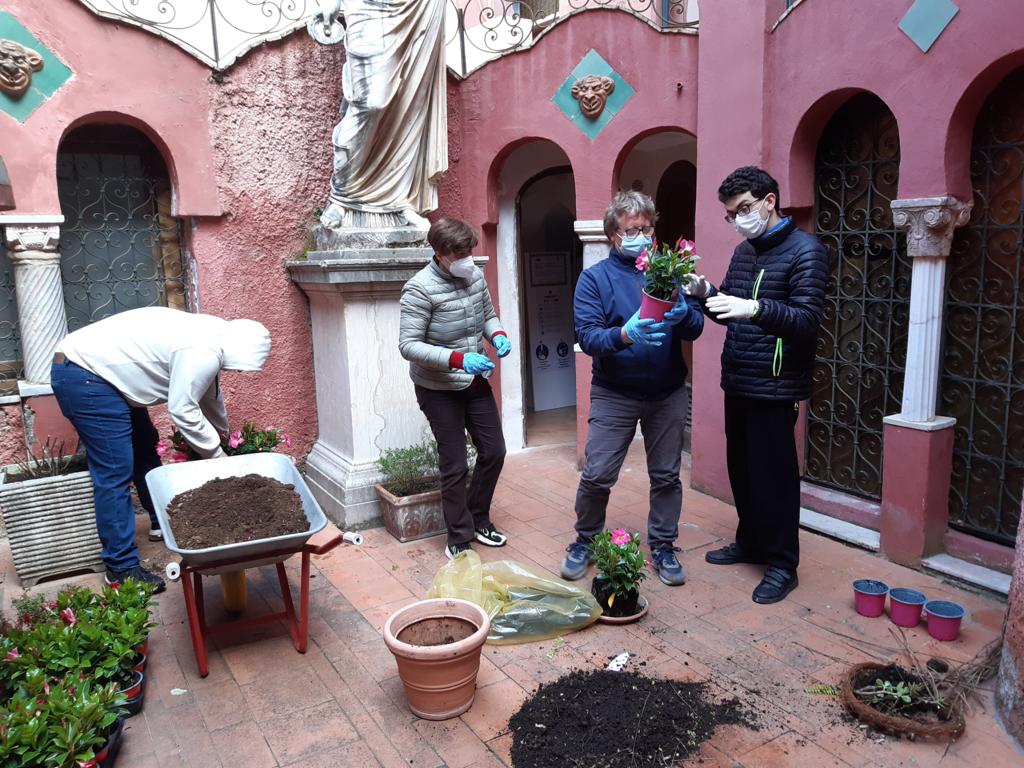 a group of people planting flowers